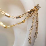 14k GOLD DOUBLE EAR CHAIN - CYLINDER AND BEADED CHAINS - CRINKLE AND MICRO HEART CHAIN ACCENTS